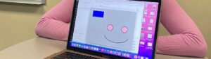Smiley face graphic on computer