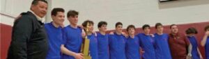Boys Basketball Team with Trophy